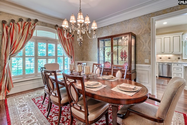 104 Preserve Ln, Columbia, SC 29209 - dining space with a chandelier, wainscoting, ornamental molding, wood finished floors, and wallpapered walls