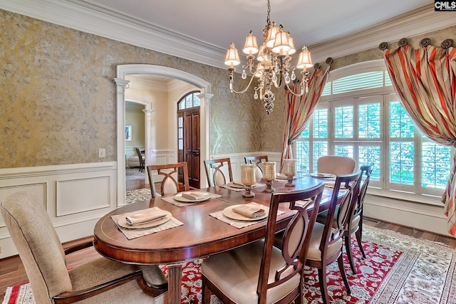 104 Preserve Ln, Columbia, SC 29209 - dining area featuring arched walkways, wallpapered walls, ornate columns, wainscoting, and wood finished floors