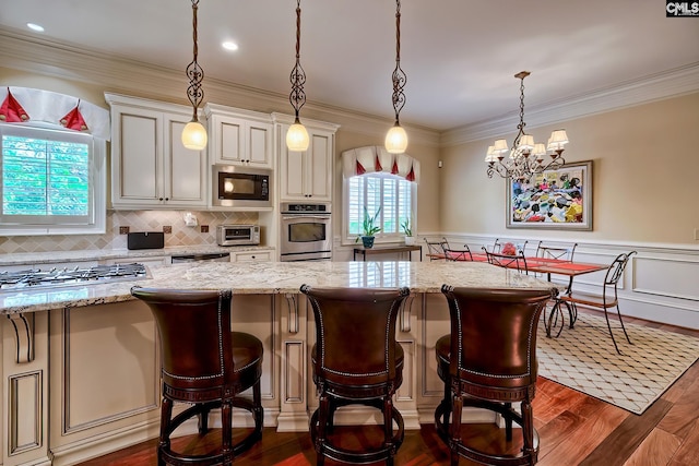 104 Preserve Ln, Columbia, SC 29209 - kitchen with appliances with stainless steel finishes, dark wood-type flooring, light stone countertops, tasteful backsplash, and ornamental molding