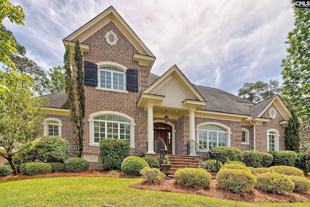 104 Preserve Ln, Columbia, SC 29209 - view of front facade featuring brick siding, roof with shingles, and a front lawn