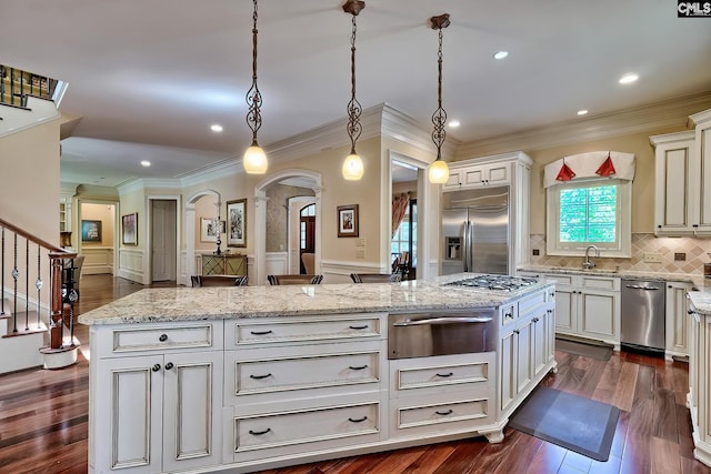 104 Preserve Ln, Columbia, SC 29209 - kitchen featuring a warming drawer, appliances with stainless steel finishes, ornamental molding, arched walkways, and a sink