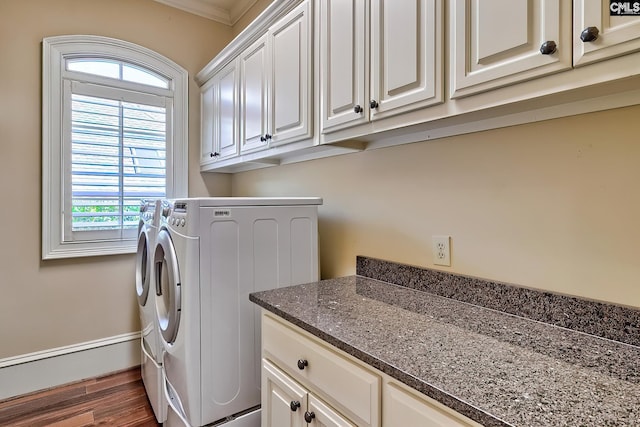 104 Preserve Ln, Columbia, SC 29209 - washroom featuring washing machine and clothes dryer, cabinet space, wood finished floors, baseboard heating, and crown molding