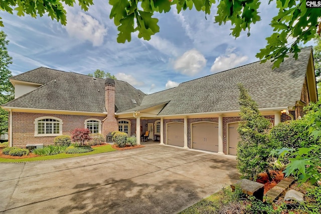 104 Preserve Ln, Columbia, SC 29209 - view of front facade with brick siding, a shingled roof, an attached garage, driveway, and a chimney