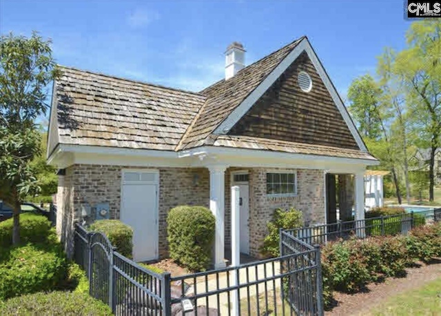 104 Preserve Ln, Columbia, SC 29209 - view of front of house featuring brick siding, fence, and a chimney