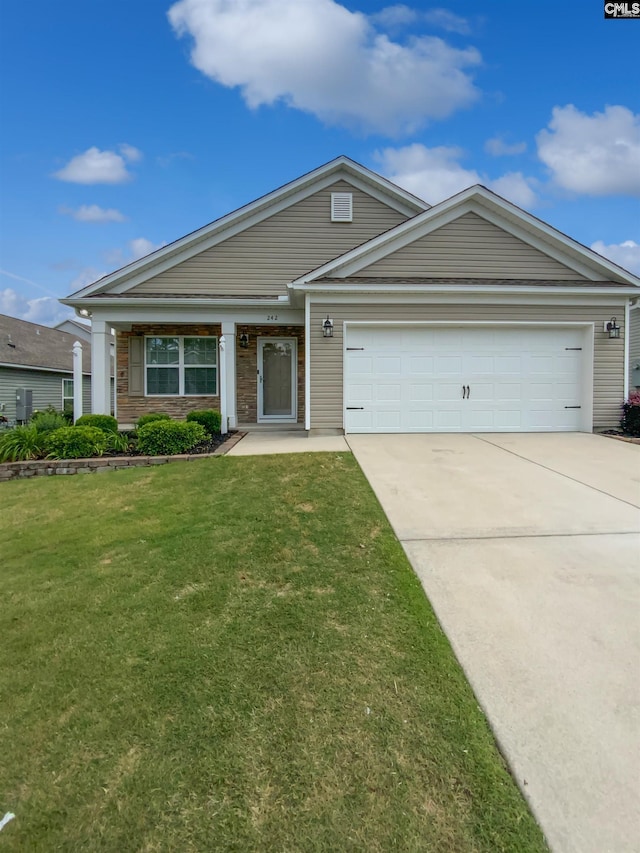ranch-style home with a garage, concrete driveway, and a front lawn