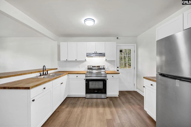 4520 Bluff Rd, Columbia, SC 29209 - kitchen with appliances with stainless steel finishes, wood counters, a sink, under cabinet range hood, and a peninsula