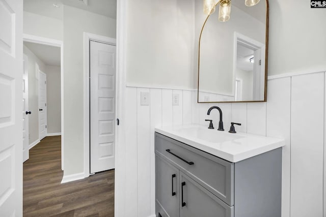 4520 Bluff Rd, Columbia, SC 29209 - bathroom featuring wood finished floors, vanity, and a wainscoted wall
