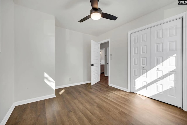 4520 Bluff Rd, Columbia, SC 29209 - unfurnished bedroom with baseboards, wood finished floors, a closet, and ceiling fan