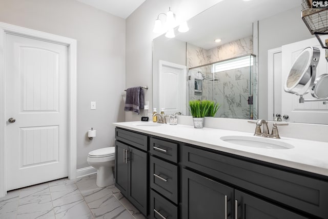 bathroom featuring a marble finish shower, toilet, marble finish floors, and double vanity
