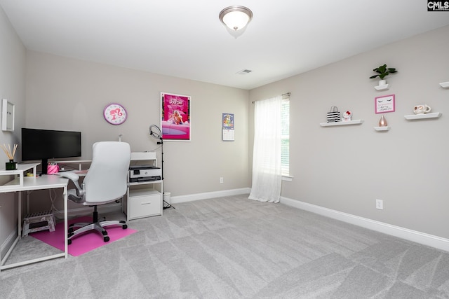 carpeted office space featuring baseboards