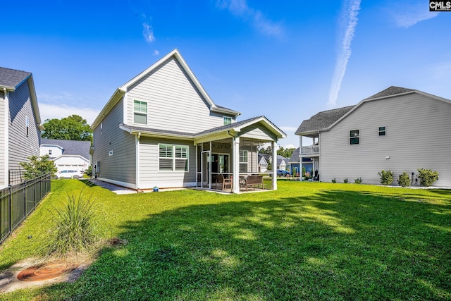 back of property featuring a sunroom
