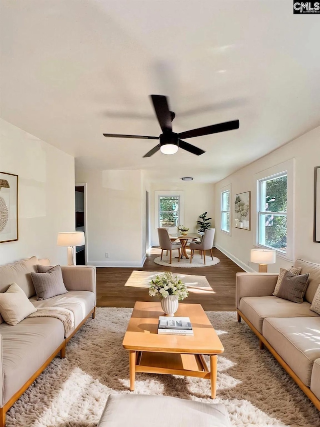 1306 Bonner Ave, Columbia, SC 29204 - living room featuring ceiling fan, wood finished floors, and baseboards