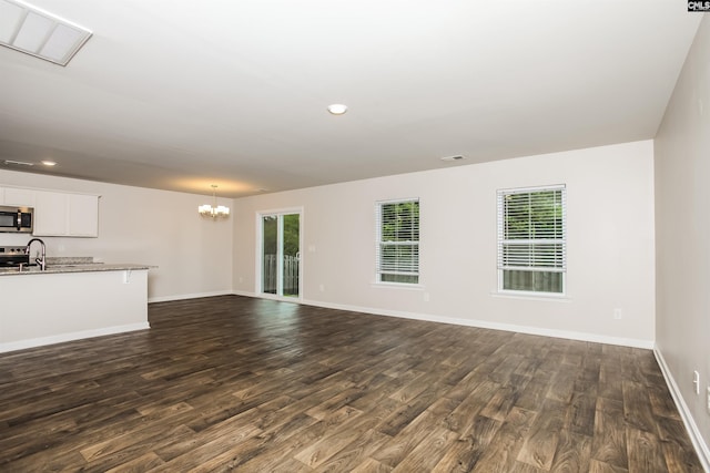 341 Nehemiah Rd, Lexington, SC 29072 - unfurnished living room featuring a chandelier, dark wood finished floors, healthy amount of natural light, baseboards, and recessed lighting