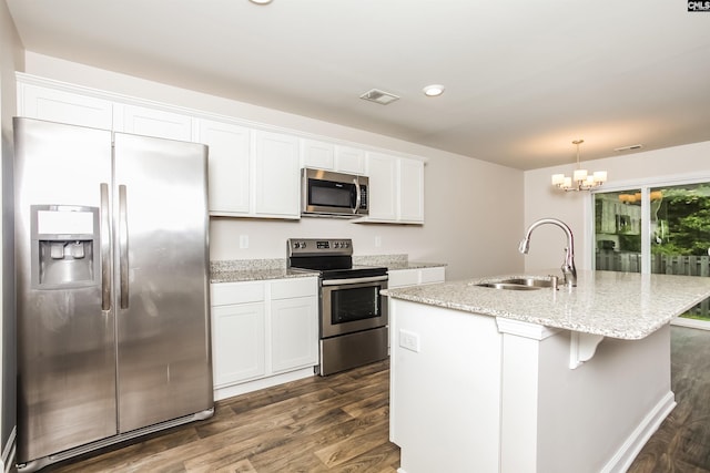 341 Nehemiah Rd, Lexington, SC 29072 - kitchen featuring appliances with stainless steel finishes, a sink, dark wood finished floors, an island with sink, and a chandelier