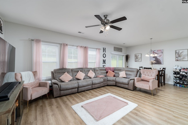 603 Rose Quartz Ln, Lexington, SC 29073 - living room featuring wood finished floors, a chandelier, and a ceiling fan