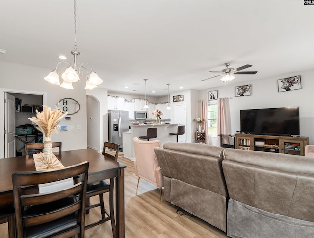 603 Rose Quartz Ln, Lexington, SC 29073 - living room featuring a ceiling fan, light wood-type flooring, arched walkways, a chandelier, and recessed lighting
