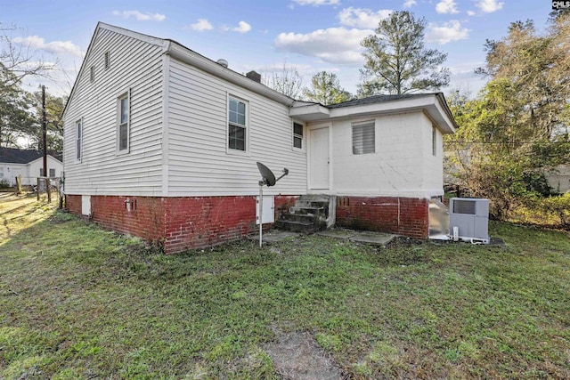 4717 Linden St, Columbia, SC 29203 - back of property with a yard, entry steps, and central AC