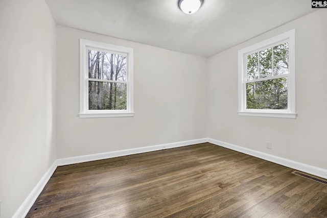 322 Glenn Ave, Columbia, SC 29203 - empty room featuring plenty of natural light, dark wood-style floors, and baseboards