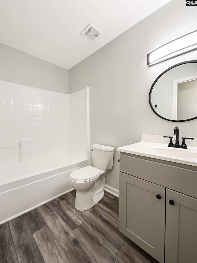 8 Brushwood Ct, Columbia, SC 29229 - bathroom featuring toilet, vanity, wood finished floors, and washtub / shower combination