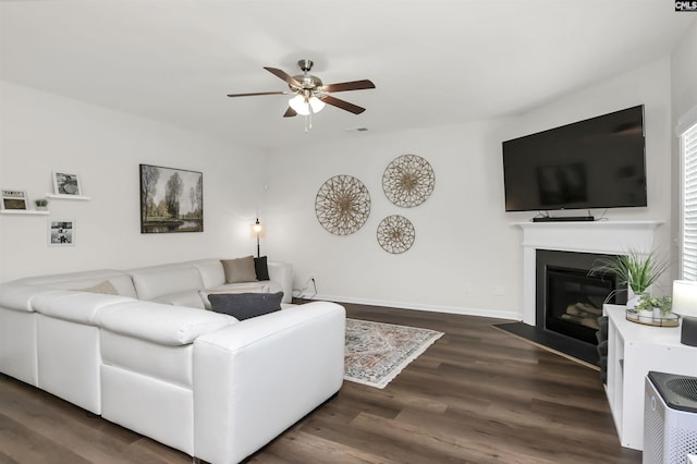 436 N Cobia Ct, Irmo, SC 29063 - living room with ceiling fan, wood finished floors, a fireplace with flush hearth, and baseboards
