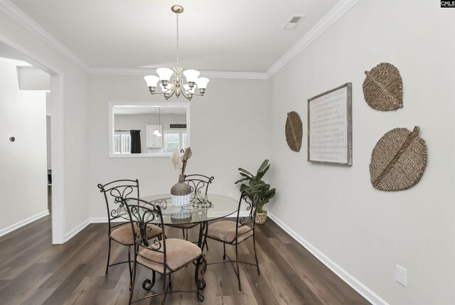 436 N Cobia Ct, Irmo, SC 29063 - dining area featuring dark wood-type flooring, a chandelier, ornamental molding, and baseboards