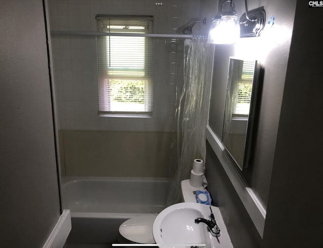 59 Dumont St, Columbia, SC 29201 - bathroom with healthy amount of natural light, a sink, toilet, and shower / bathtub combination with curtain