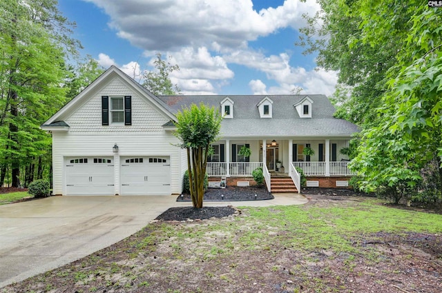 view of front of home featuring covered porch, driveway, and an attached garage