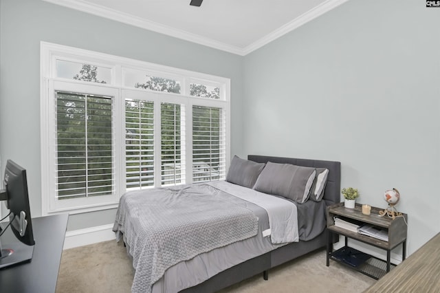 bedroom featuring carpet, crown molding, baseboards, and ceiling fan