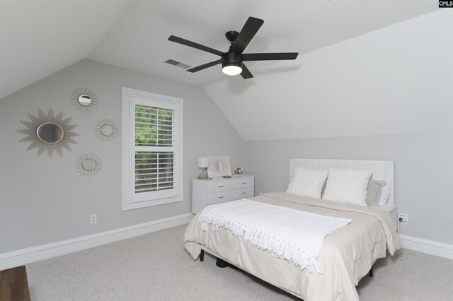 bedroom with carpet, lofted ceiling, a ceiling fan, and baseboards