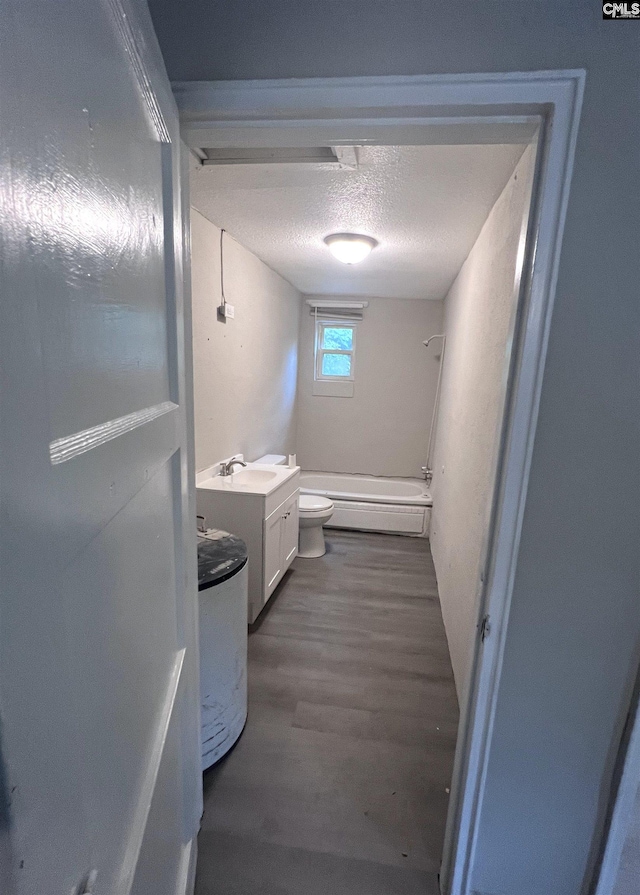 914 Prescott Rd, Columbia, SC 29203 - full bath with vanity, toilet, wood finished floors, and a textured ceiling