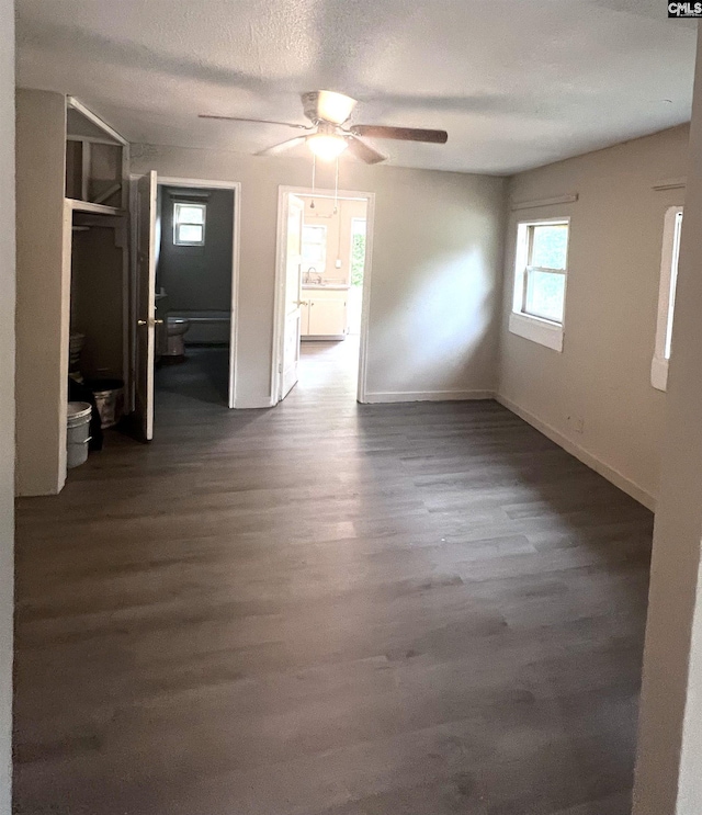914 Prescott Rd, Columbia, SC 29203 - unfurnished bedroom featuring ensuite bath, dark wood finished floors, baseboards, and a ceiling fan