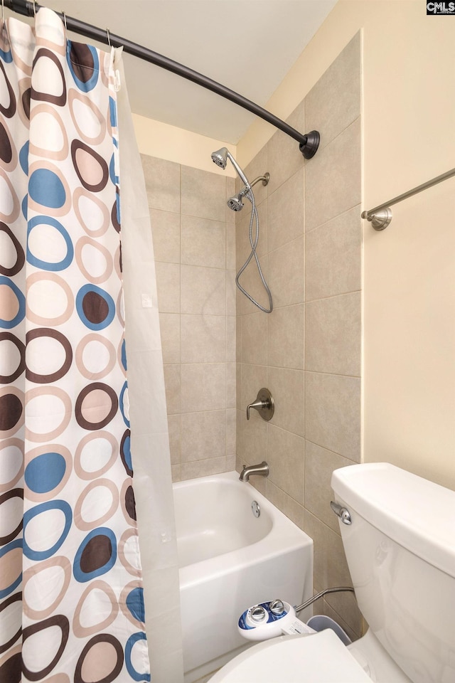 bathroom with toilet and shower / bath combo