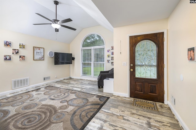 entrance foyer with wood finished floors, lofted ceiling, ceiling fan, and baseboards