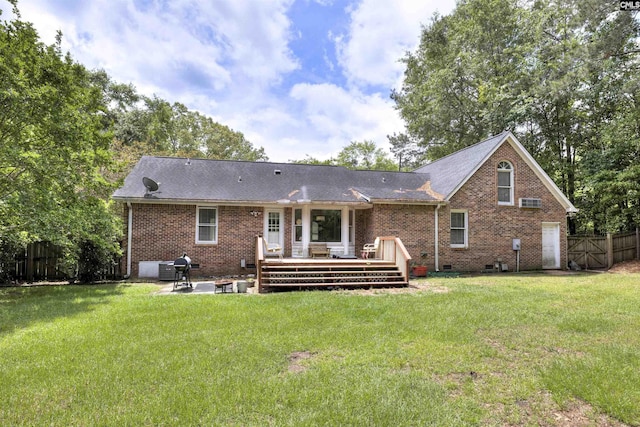 back of property featuring a patio area, a wooden deck, and brick siding