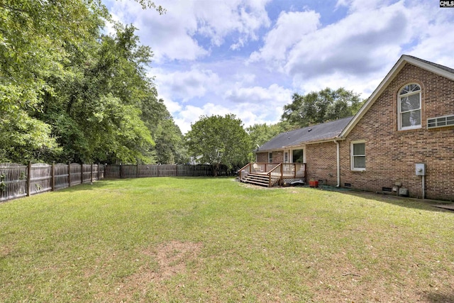view of yard featuring a wooden deck
