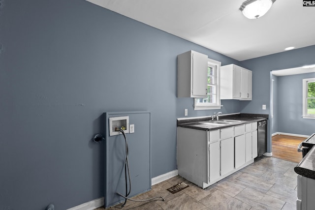 7608 Stone St, Columbia, SC 29209 - kitchen featuring a sink, dark countertops, white cabinetry, dishwasher, and baseboards