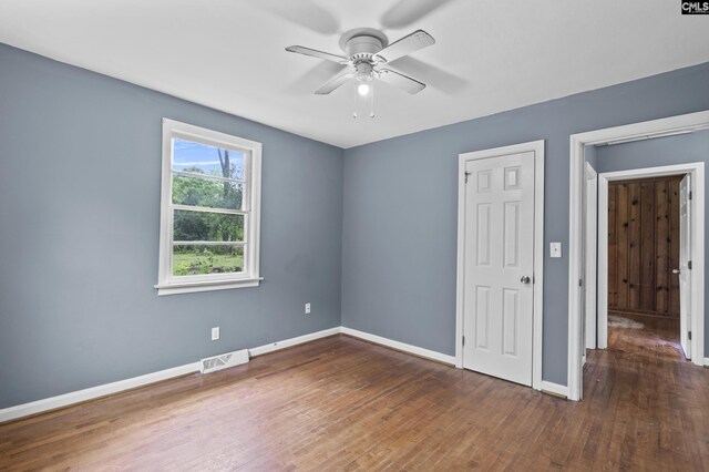 7608 Stone St, Columbia, SC 29209 - unfurnished bedroom with baseboards, wood finished floors, and ceiling fan