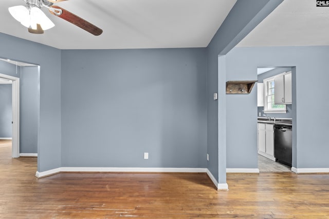 7608 Stone St, Columbia, SC 29209 - unfurnished living room featuring ceiling fan, light wood-style floors, and baseboards