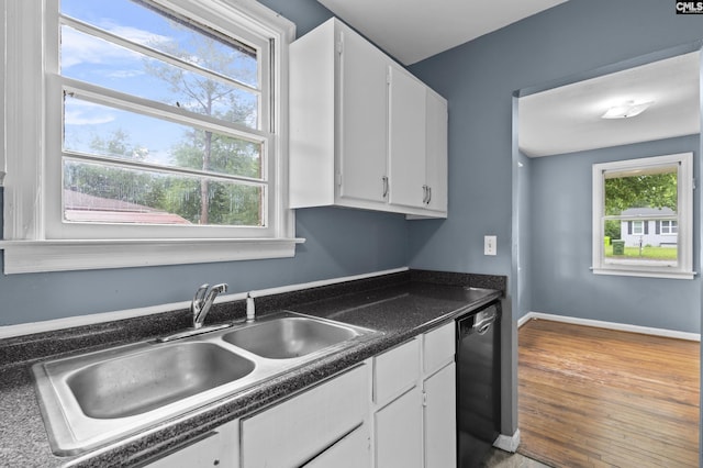 7608 Stone St, Columbia, SC 29209 - kitchen with a sink, white cabinetry, black dishwasher, dark countertops, and wood finished floors