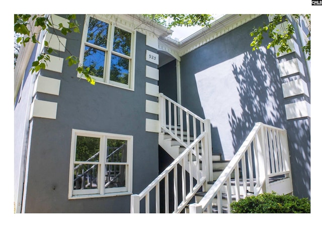 view of exterior entry with stucco siding