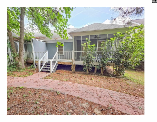 view of front of house featuring a sunroom