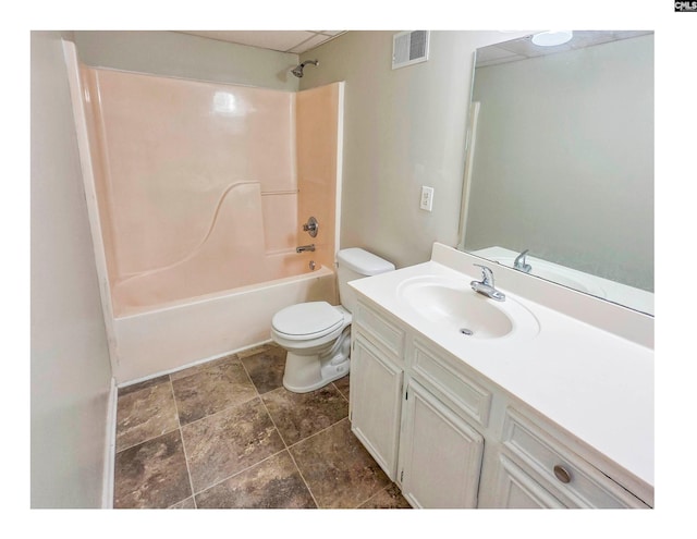bathroom with toilet, vanity, and washtub / shower combination