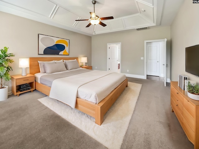 bedroom featuring light colored carpet, ceiling fan, and baseboards