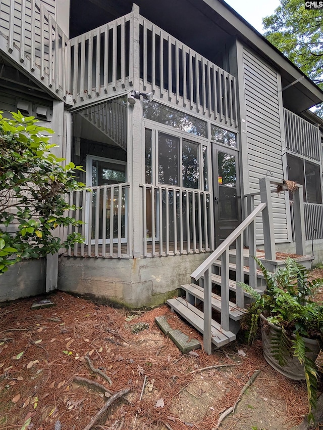 back of house featuring a balcony