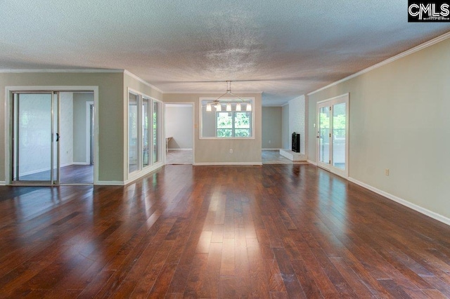 7905 Castleton Ln, Columbia, SC 29223 - unfurnished living room featuring dark wood finished floors, ornamental molding, a textured ceiling, and baseboards