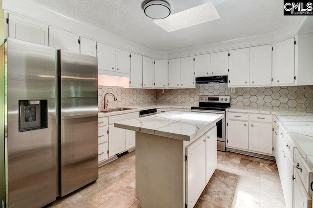 7905 Castleton Ln, Columbia, SC 29223 - kitchen with stainless steel appliances, a sink, exhaust hood, a skylight, and white cabinets
