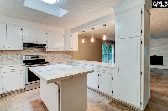 7905 Castleton Ln, Columbia, SC 29223 - kitchen featuring stainless steel range with electric stovetop, under cabinet range hood, decorative backsplash, white cabinets, and a textured ceiling