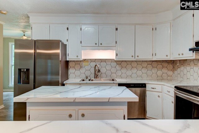 7905 Castleton Ln, Columbia, SC 29223 - kitchen featuring a sink, stainless steel appliances, decorative backsplash, white cabinetry, and ornamental molding