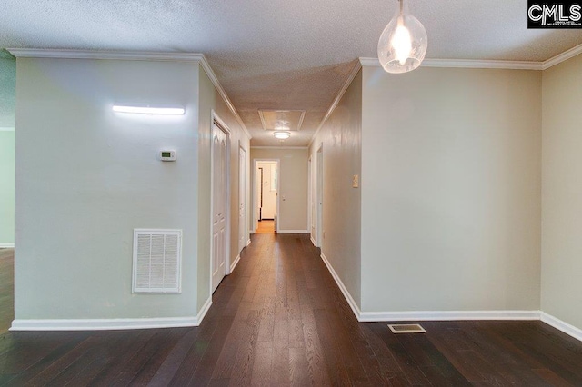 7905 Castleton Ln, Columbia, SC 29223 - hallway with dark wood finished floors, baseboards, attic access, a textured ceiling, and ornamental molding