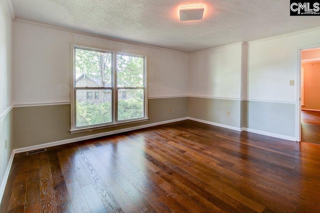 7905 Castleton Ln, Columbia, SC 29223 - spare room with ornamental molding, a textured ceiling, wood-type flooring, and baseboards